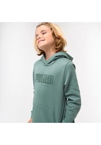 Bluza dziecięca Puma z kapturem. Typ kołnierza: kaptur. Kolor: zielony. Materiał: materiał, bawełna. Sport: joga i pilates