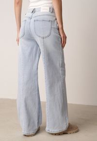 Born2be - Niebieskie Szerokie Jeansy z Wysokim Stanem Przeszyciami i Imitacją Kieszeni Tanila. Okazja: na co dzień, na spotkanie biznesowe, do pracy. Stan: podwyższony. Kolor: niebieski. Styl: casual, biznesowy, elegancki, klasyczny #4