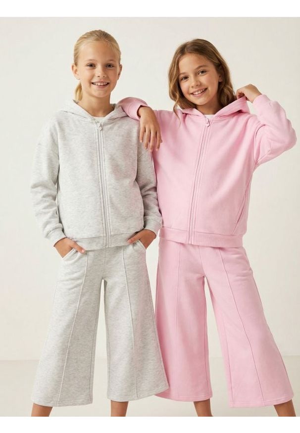 Sinsay - Spodnie dresowe wide leg - różowy. Kolor: różowy. Materiał: dresówka