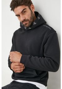 Calvin Klein Jeans bluza męska kolor czarny z kapturem gładka. Typ kołnierza: kaptur. Kolor: czarny. Wzór: gładki #1