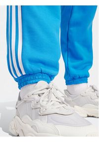 Adidas - adidas Spodnie dresowe adicolor Classics 3-Stripes IR8092 Niebieski Regular Fit. Kolor: niebieski. Materiał: bawełna #5