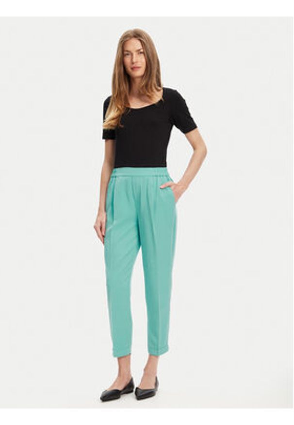 United Colors of Benetton - United Colors Of Benetton Spodnie materiałowe 4Y09DF079 Zielony Regular Fit. Kolor: zielony. Materiał: lyocell