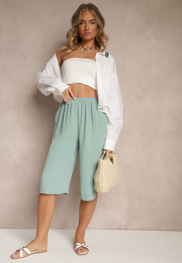 Renee - Jasnozielone Luźne Spodnie 3/4 z Kieszonkami Efrinea. Okazja: na co dzień. Kolor: zielony. Materiał: guma. Styl: elegancki, casual