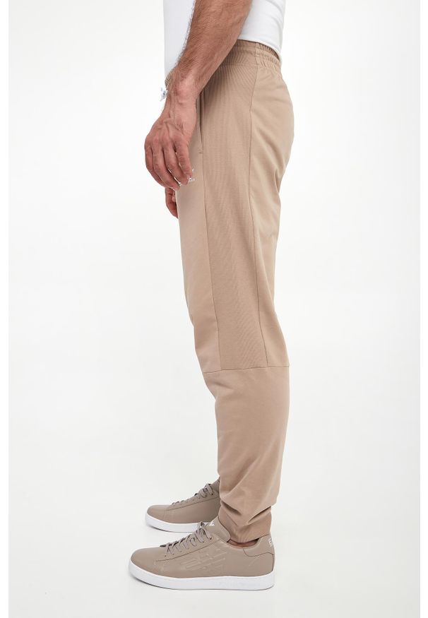 EA7 Emporio Armani - Spodnie dresowe męskie EA7 EMPORIO ARMANI. Materiał: dresówka