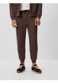 Reserved - Spodnie dresowe slim fit - beżowy. Kolor: beżowy. Materiał: dresówka