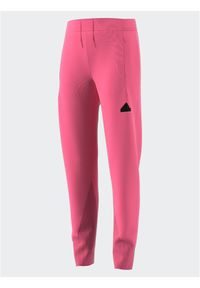 Adidas - adidas Spodnie dresowe IK5714 Różowy Regular Fit. Kolor: różowy. Materiał: bawełna