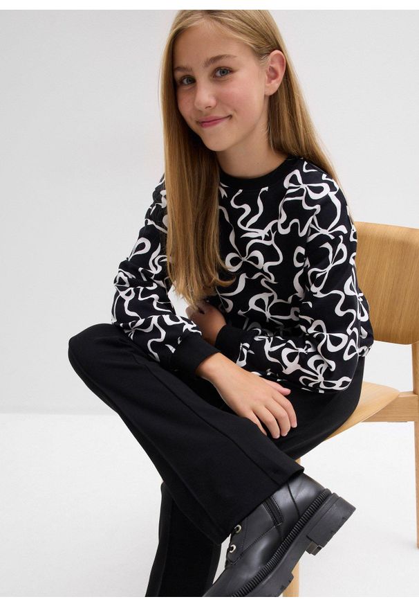 bonprix - Spodnie z rozszerzanymi nogawkami z mocnej bawełnianej dzianiny dżersejowej. Kolor: czarny. Materiał: jersey, bawełna, dzianina