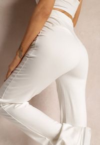 Renee - Białe Spodnie Szerokie Tanora. Kolor: biały. Materiał: tkanina. Długość: długie. Wzór: gładki, jednolity, aplikacja