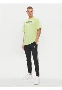 Adidas - adidas Spodnie dresowe Essentials Single Jersey Tapered Open Hem 3-Stripes Joggers IC0044 Czarny Regular Fit. Kolor: czarny. Materiał: bawełna