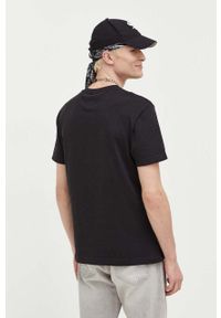 Tommy Jeans t-shirt bawełniany kolor czarny z aplikacją. Kolor: czarny. Materiał: bawełna. Długość rękawa: krótki rękaw. Długość: krótkie. Wzór: aplikacja. Styl: klasyczny #3