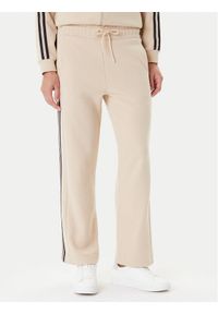 EA7 Emporio Armani Spodnie dresowe 7W000568 AF15528 U1046 Beżowy Relaxed Fit. Kolor: beżowy. Materiał: syntetyk