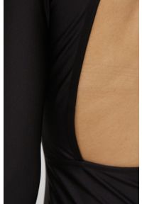Puma sukienka Crystal G. kolor czarny mini dopasowana. Kolor: czarny. Materiał: dzianina, materiał. Długość rękawa: długi rękaw. Typ sukienki: dopasowane. Długość: mini