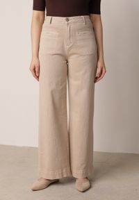 Born2be - Beżowe Bawełniane Jeansy z Szeroką Nogawką i Ozdobnymi Kieszeniami Ginorvienne. Okazja: na co dzień. Stan: podwyższony. Kolor: beżowy. Styl: elegancki, casual, wizytowy #1