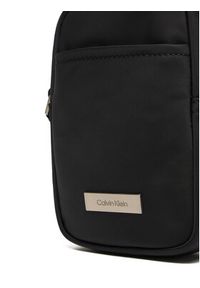 Calvin Klein Saszetka Sleek Slim Reporter LV04D3233G Czarny. Kolor: czarny. Materiał: materiał #6