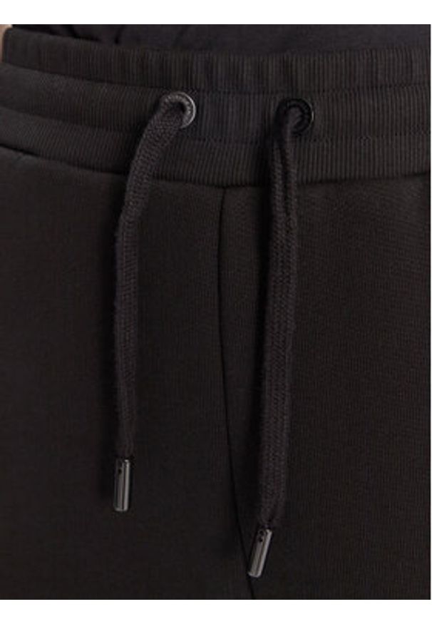 AMI PARIS - AMI Paris Spodnie dresowe UTR237.749 Czarny Relaxed Fit. Kolor: czarny. Materiał: bawełna, syntetyk
