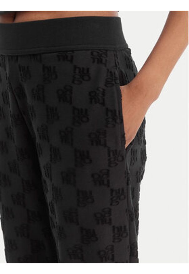 Hugo - HUGO Spodnie dresowe Monogram 50556809 Czarny Regular Fit. Kolor: czarny. Materiał: bawełna