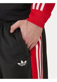 Adidas - adidas Spodnie dresowe KE0117 Czarny Loose Fit. Kolor: czarny. Materiał: syntetyk #3