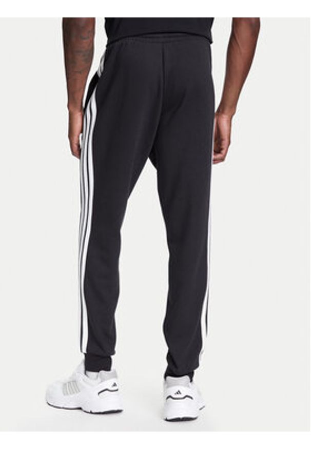 Adidas - adidas Spodnie dresowe Essentials 3-Stripes JD1861 Czarny Regular Fit. Kolor: czarny. Materiał: bawełna