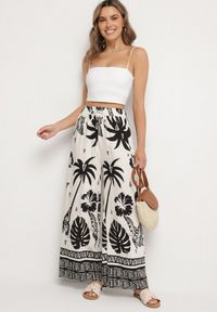 Born2be - Czarno-Beżowe Spodnie z Tropikalnym Wzorem i Szerokimi Nogawkami Emivelli. Okazja: na co dzień. Kolor: czarny. Styl: elegancki, casual #5