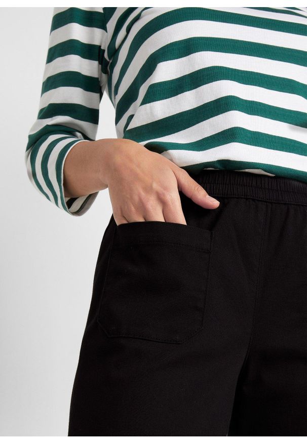 bonprix - Spodnie twillowe high-waist z poszerzanymi nogawkami i wygodnym paskiem. Stan: podwyższony. Kolor: czarny