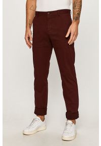 Tommy Hilfiger Tailored - Spodnie. Kolor: czerwony. Materiał: tkanina. Wzór: gładki