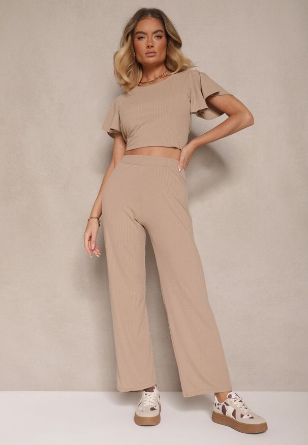 Renee - Ciemnobeżowe Szerokie Spodnie z Delikatnie Prążkowanego Materiału Kasaida. Kolor: beżowy. Materiał: prążkowany, materiał. Sezon: lato