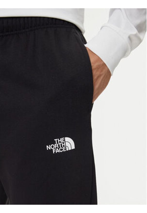 The North Face Spodnie dresowe Simple Dome NF0A8C1W Czarny Regular Fit. Kolor: czarny. Materiał: bawełna