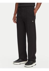 Hugo - HUGO Spodnie dresowe Dabinpant 50563020 Czarny Relaxed Fit. Kolor: czarny. Materiał: bawełna #1