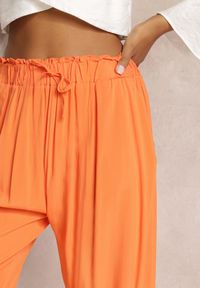 Renee - Pomarańczowe Spodnie Karrill. Kolor: pomarańczowy. Materiał: wiskoza. Długość: długie. Sezon: lato. Styl: elegancki