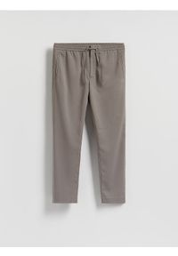 Reserved - Spodnie joggery - brązowy. Kolor: brązowy. Materiał: wiskoza, tkanina