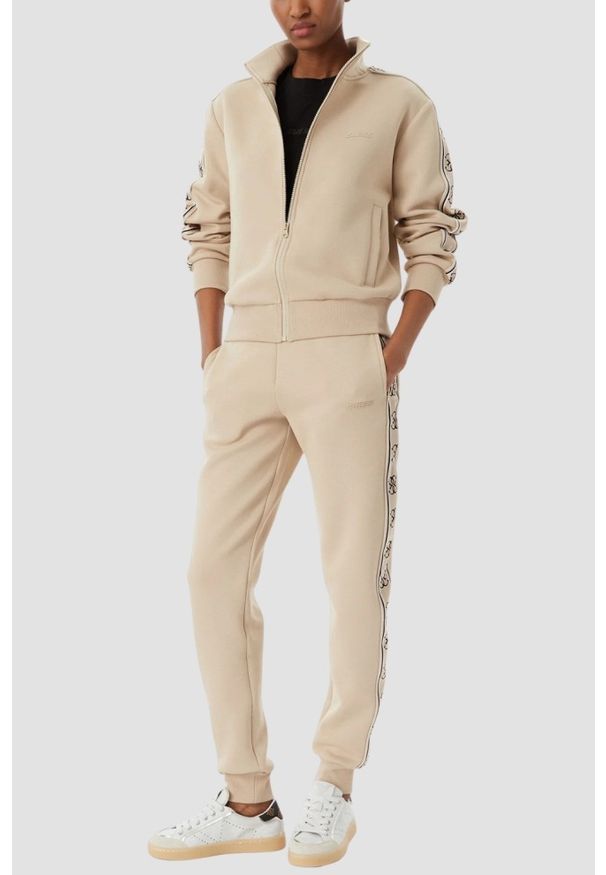 Guess - GUESS Beżowe damskie spodnie dresowe z lampasami Britney Jogger, Rozmiar M. Kolor: beżowy. Materiał: dresówka