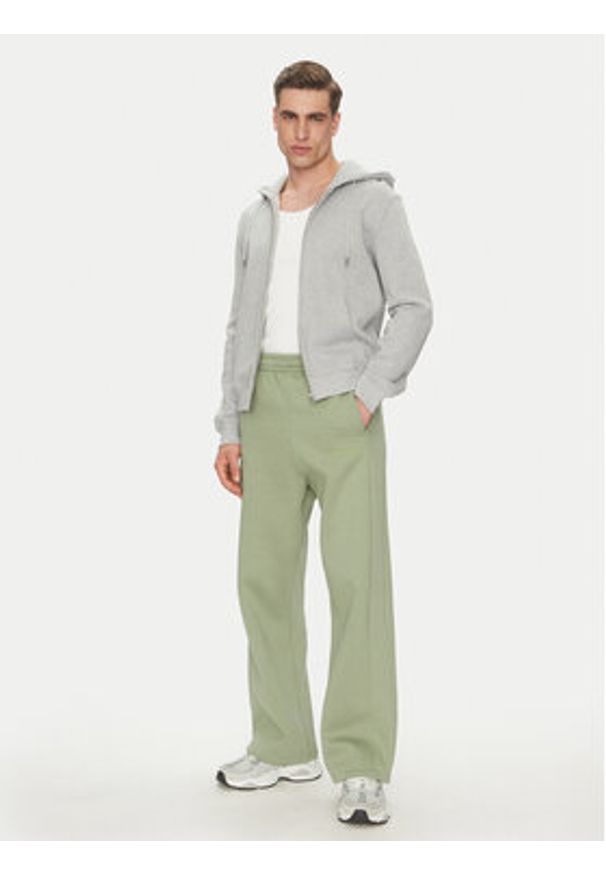 Karl Kani Spodnie dresowe Ellipse Straight Leg 60060043 Khaki Relaxed Fit. Kolor: brązowy. Materiał: syntetyk