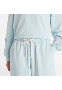 Spodnie damskie New Balance WP41513FRL – niebieskie. Stan: podwyższony. Kolor: niebieski. Materiał: bawełna, dresówka. Wzór: ze splotem #2