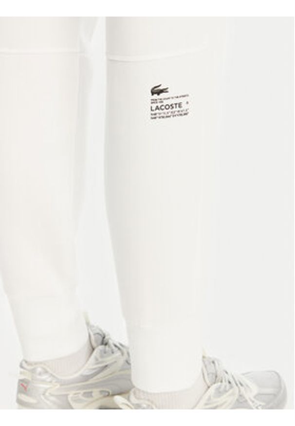 Lacoste Spodnie dresowe XF0343 Biały Regular Fit. Kolor: biały. Materiał: bawełna