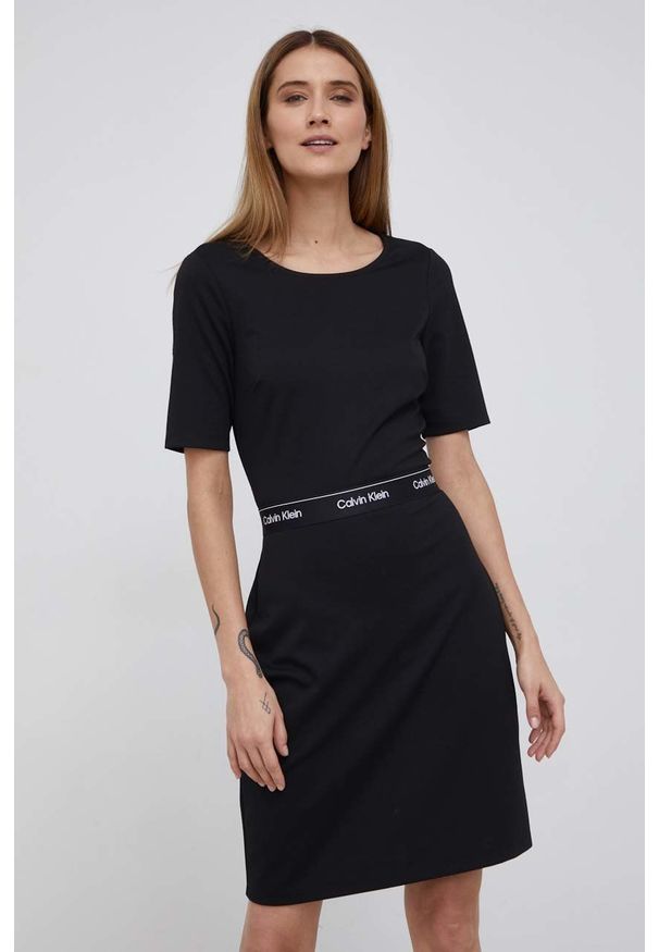Calvin Klein Sukienka kolor czarny mini rozkloszowana. Kolor: czarny. Materiał: dzianina, włókno. Długość rękawa: krótki rękaw. Wzór: aplikacja. Typ sukienki: rozkloszowane. Długość: mini