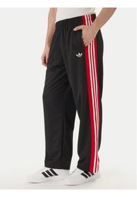 Adidas - adidas Spodnie dresowe KE0117 Czarny Loose Fit. Kolor: czarny. Materiał: syntetyk #1