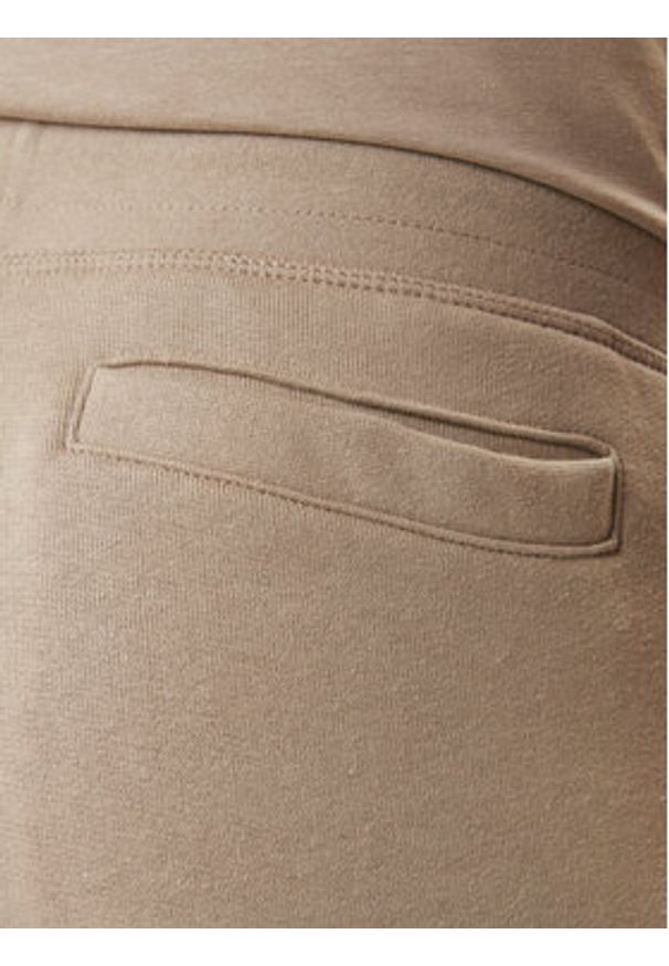 Guess Spodnie dresowe Z2YB22 K9V31 Beżowy Regular Fit. Kolor: beżowy. Materiał: bawełna
