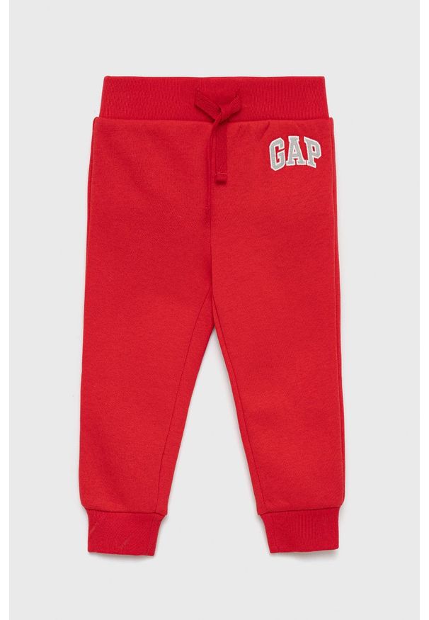 GAP spodnie dresowe dziecięce kolor czerwony gładkie. Okazja: na co dzień. Kolor: czerwony. Materiał: dresówka. Wzór: gładki. Styl: casual