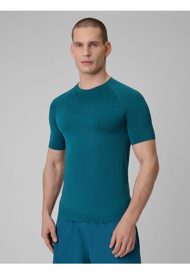4f - 4F Koszulka treningowa slim bezszwowa męska - granatowa L/XL. Kolor: niebieski. Materiał: skóra. Długość rękawa: raglanowy rękaw. Długość: długie. Sport: fitness