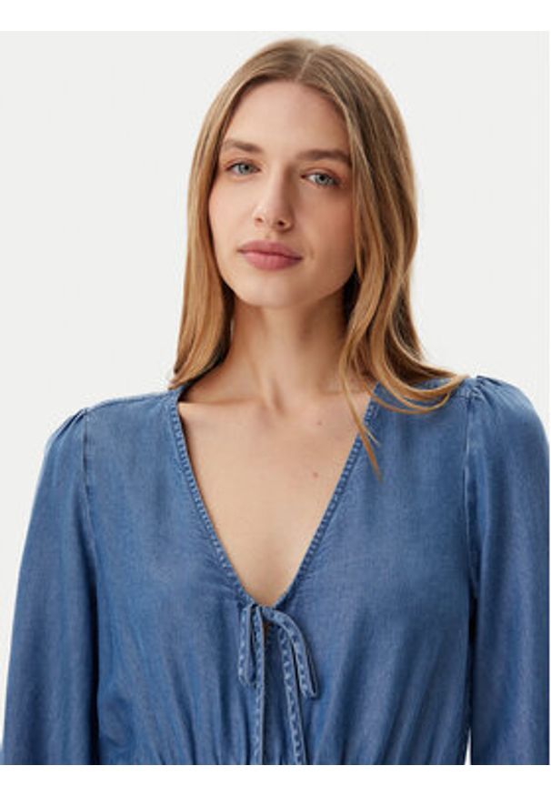 Tommy Jeans Sukienka codzienna DW0DW20612 Niebieski Relaxed Fit. Okazja: na co dzień. Kolor: niebieski. Materiał: lyocell. Typ sukienki: proste. Styl: casual