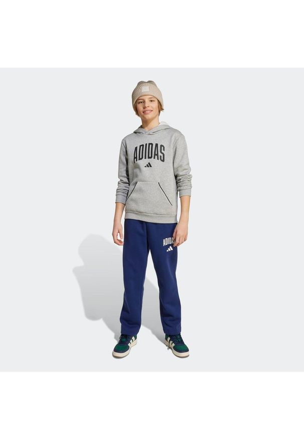 Adidas - Spodnie dziecięce ADIDAS. Kolor: niebieski. Materiał: materiał. Sport: joga i pilates