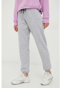 DKNY - Dkny spodnie dresowe damskie kolor szary gładkie. Kolor: szary. Materiał: dresówka. Wzór: gładki #1