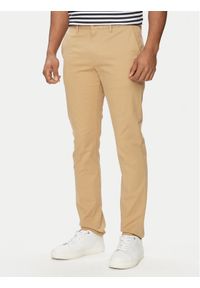 TOMMY HILFIGER - Tommy Hilfiger Chinosy Bleecker MW0MW26619 Beżowy Slim Fit. Kolor: beżowy. Materiał: bawełna