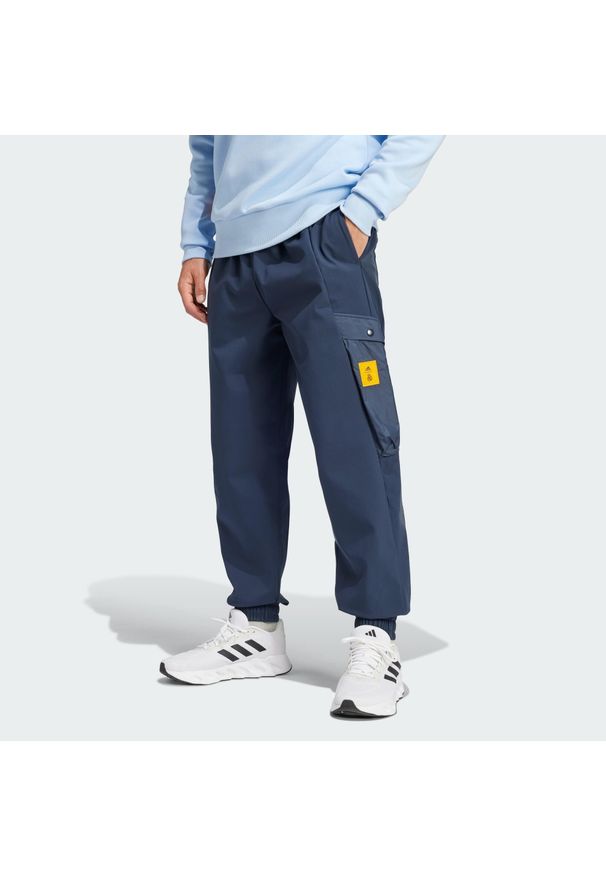 Adidas - Spodnie Real Madrid Seasonal Cargo. Kolor: niebieski. Materiał: materiał. Sport: piłka nożna