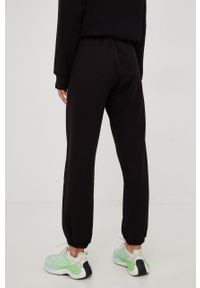 DKNY - Dkny spodnie dresowe damskie kolor czarny gładkie. Kolor: czarny. Materiał: dresówka. Wzór: gładki #4