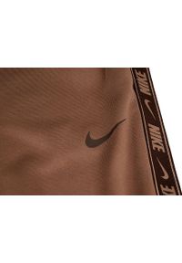 Nike - Spodnie treningowe damskie NSW PK Tape Reg. Kolor: brązowy