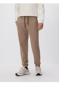 Reserved - Spodnie dresowe slim fit - beżowy. Kolor: beżowy. Materiał: dresówka