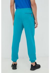 Puma spodnie dresowe bawełniane męskie kolor turkusowy z aplikacją. Kolor: turkusowy. Materiał: bawełna, dresówka. Wzór: aplikacja #4