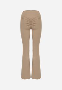 Born2be - Beżowe Legginsy Typu Dzwony z Wysokim Stanem Orralise. Stan: podwyższony. Kolor: beżowy. Materiał: tkanina. Styl: klasyczny #6