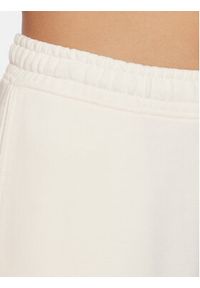 Tommy Jeans Spodnie dresowe New Varisty DW0DW16379 Biały Relaxed Fit. Kolor: biały. Materiał: bawełna, dresówka